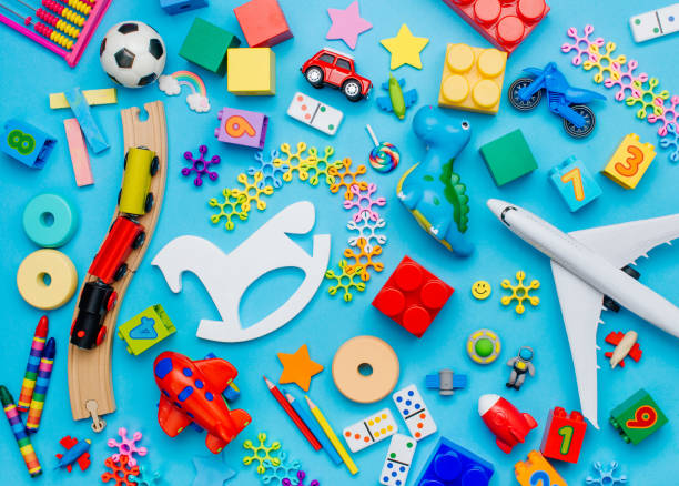 Set of kids toys on blue background Set of kids toys on blue background. Top view, flat lay. extinct photos stock pictures, royalty-free photos & images
