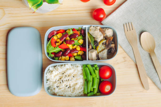 istock Lunch box with rice and vegetables on the wooden table 1178208389