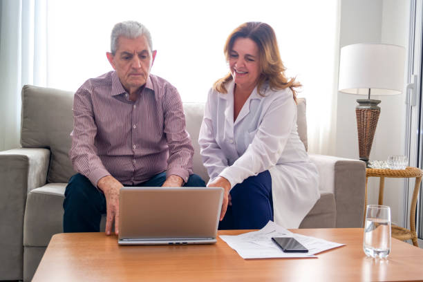 istock Senior man and a woman at home using a laptop. 1178212272