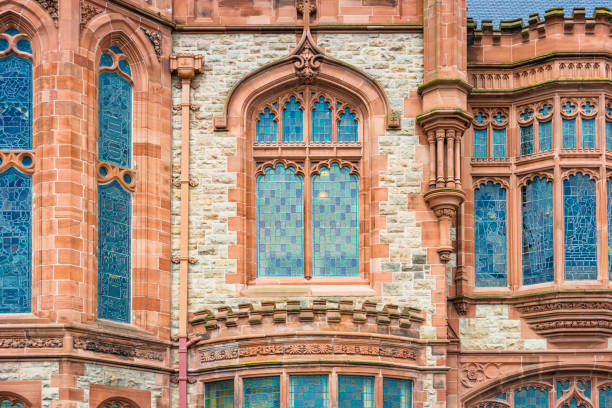 A historic building is seen through a traditional window, creating an atmospheric scene. The architecture provides a glimpse into the past, showcasing classic design elements and urban life.