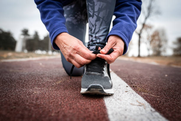 istock Woman Tying Shoelaces 1178215810