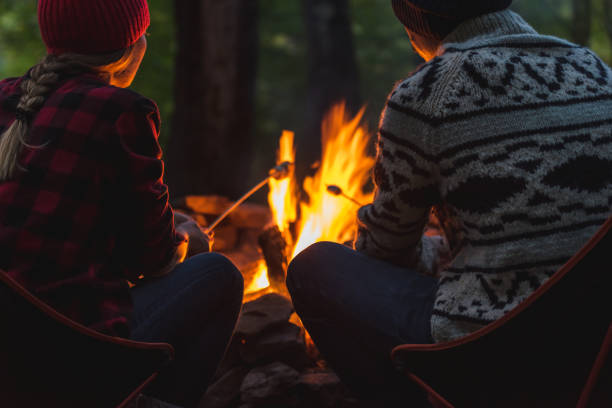 A couple roast marshmallows together stock photo