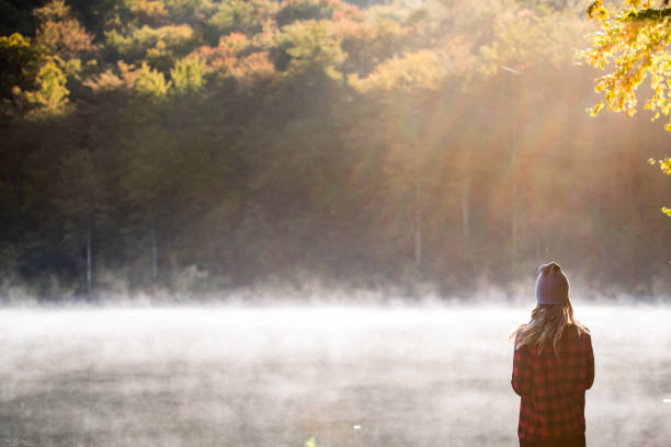 istock Young woman hiking with coffee 1178217618