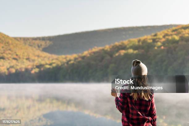 Young Woman Hiking With Coffee Stock Photo - Download Image Now - Autumn, Camping, Adventure