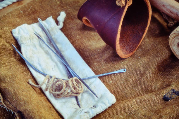istock Ship equipment for the needs of sailors on deck.Large thread with needles, leather bracelet sailor vintage style, close-up. 1178217633