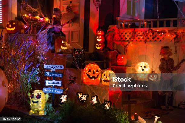 A House With Halloween Pumpkins And Halloween Decorations At Halloween Night On A City Street Trick Or Treat Stock Photo - Download Image Now