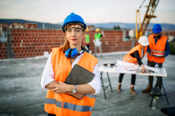 istock Confident architect woman standing at construction site 1178231133