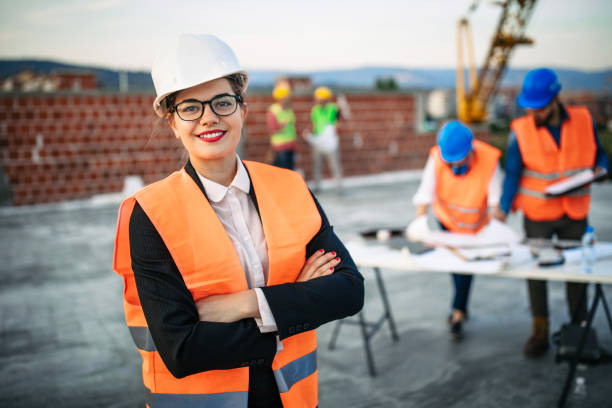 istock Confident architect woman standing at construction site 1178231184