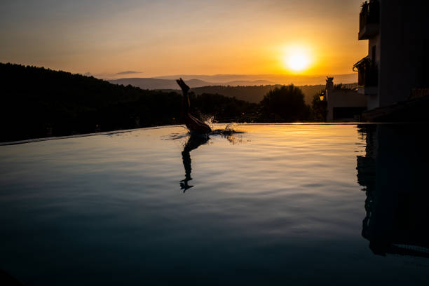 istock The girl jumps into the pool 1178235361