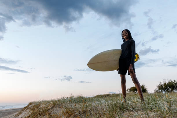 istock African-Australian Female Surfer At Sunrise 1178236431