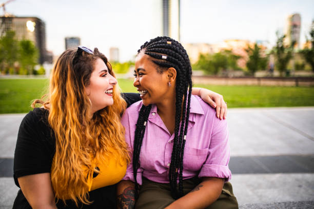 istock Two beautiful friends laughing 1178246591