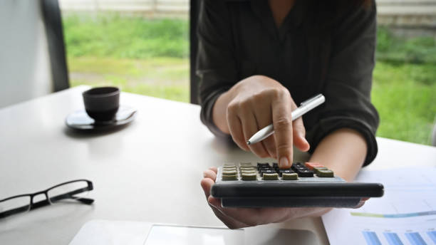 istock Cropped shot woman calculation finance data on table. 1178248983