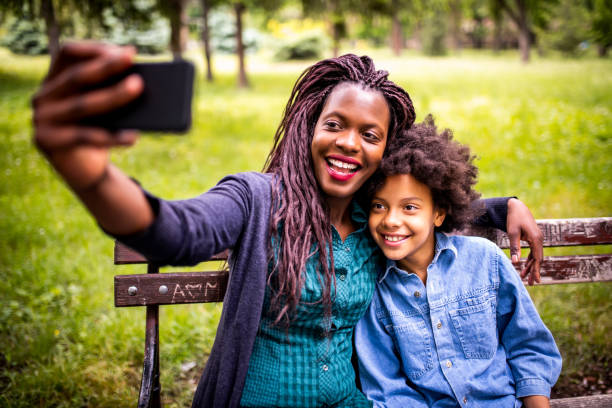 istock Mother and daughter making a selfie 1178250469