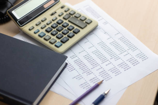 istock Financial accounting report on table with book and calculator 1178257211