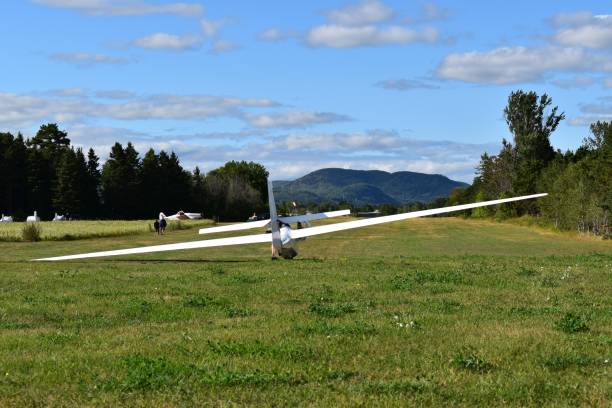 istock Glider plane on a field under preparation for next flight in a beautiful and quiet environment. 1178258304