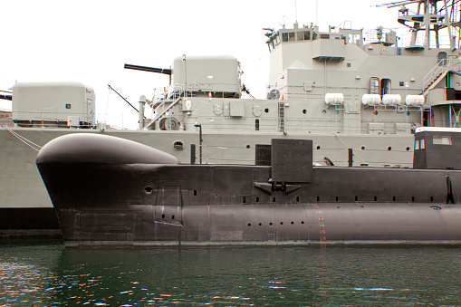 Sydney Australia Dec. 27, 2018: Navy frigat and a submarin mooredin the harbour.