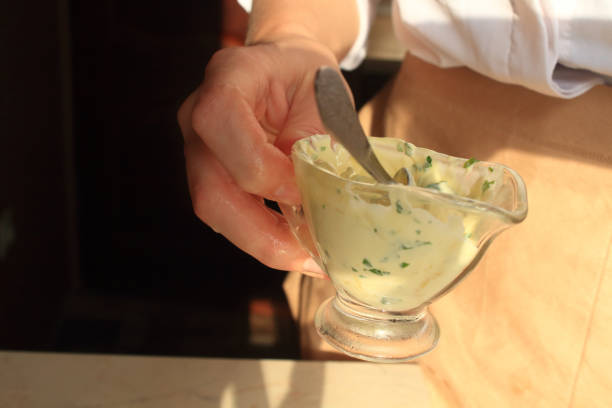 istock Garlic sauce in woman's hands 1178262092