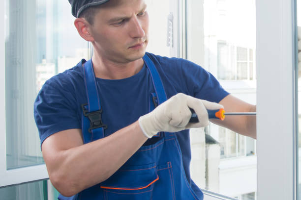 istock worker in blue uniform, adjusts the correct closing and opening of a plastic window 1178262098