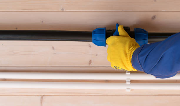 istock on a light wooden wall, a yellow-gloved worker