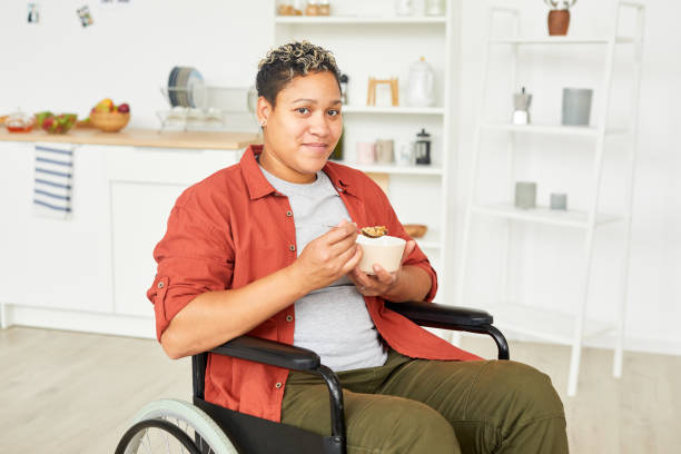 istock Disabled woman eating porridge 1178263953