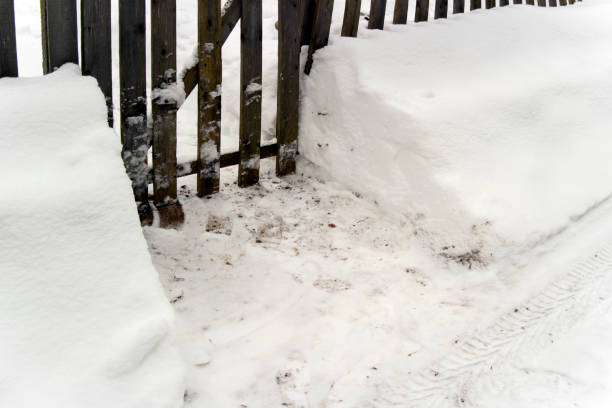 istock snow swept street and a house gate 1178266165