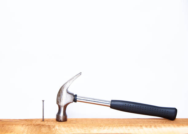 istock Hammer and construction nails on isolated white background close-up. With place under the text. 1178268066