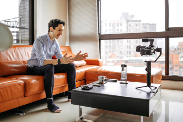 istock Influencer filming a vlog from his apartment 1178270585