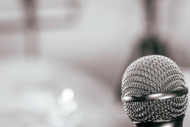 istock microphone in retro style on blurred black and white background 1178270853