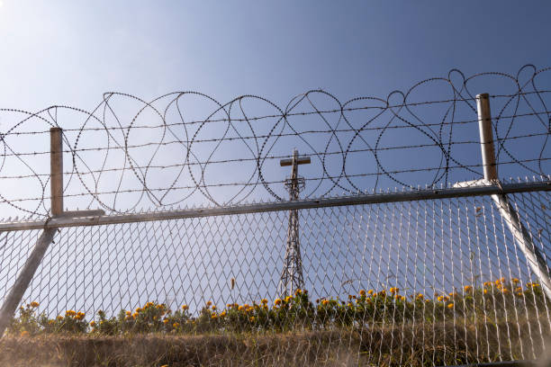 istock Cross and barbed wire at the Korean DMZ 1178271714