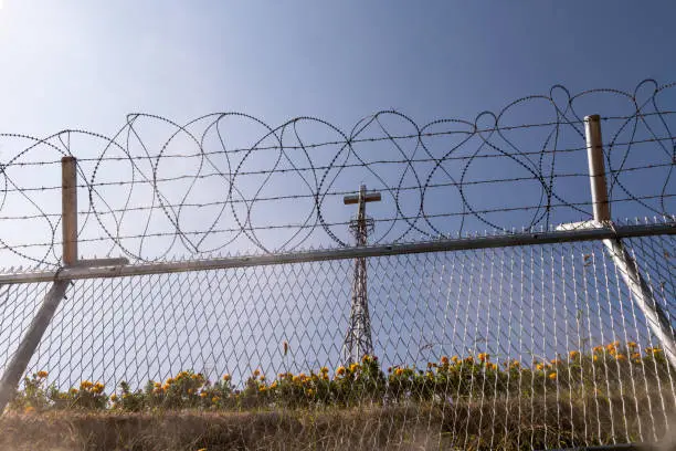 Photo of Cross and barbed wire at the Korean DMZ