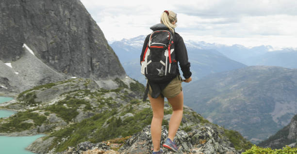 istock Female hiker walks along mountain ridge 1178271841
