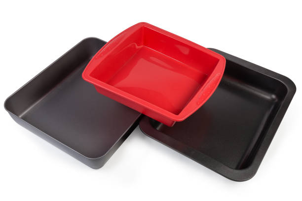istock Empty metal nonstick and silicone baking trays on white background 1178273876