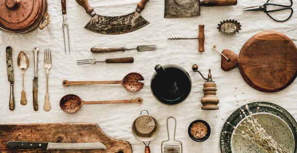 istock Various kitchen utensils and tablewear over linen tablecloth, wide composition 1178276489