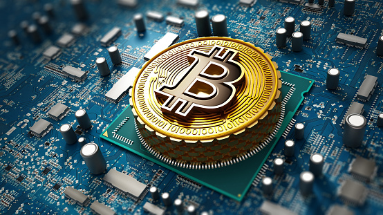 Crypto moneda / Concepto Blockchain con moneda en la placa base photo