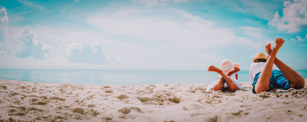 istock father with little daughter relax on beach 1178278109