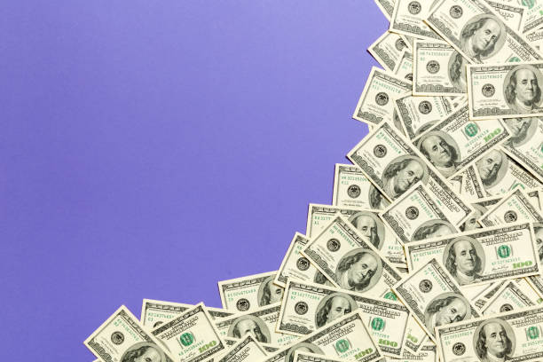 istock One hundred dollar banknotes on colored background top view, with empty place for your text business money concept. One hundred dollar background. 1178278186