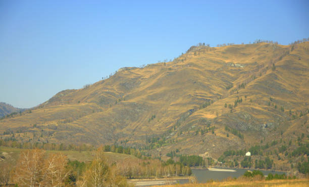 istock High mountain range and river flowing below, autumn landscape. 1178278933