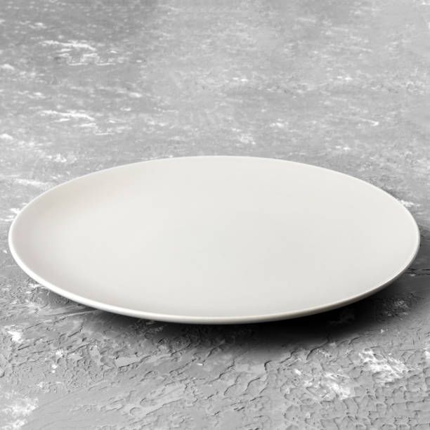istock Perspective view. Empty white plate on wooden background 1178279300