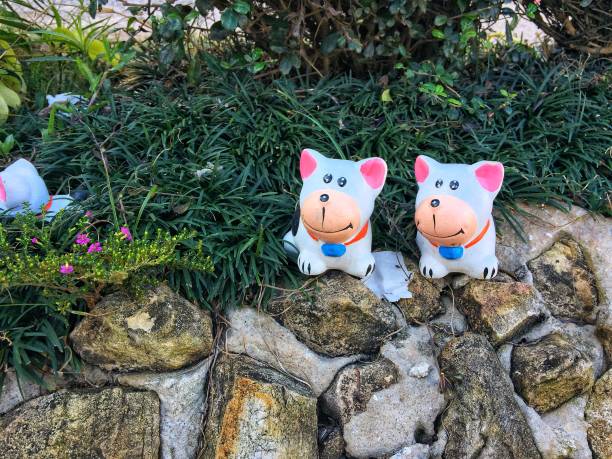 Small animal figurines are at the garden.