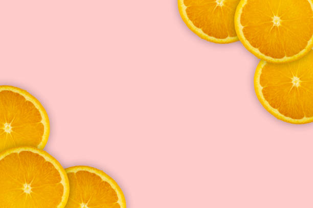 istock Slices orange on pink background. Background and pattern concept 1178280535