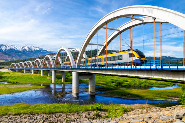 Suburb passenger train From Krakow to Zakopane drive through the viaduct towards the Tatra Mountains, Poland