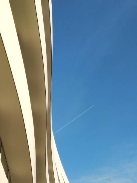 istock Building and blue sky with airplane 1178284056