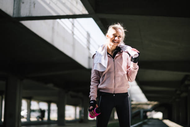 istock Young woman taking a break from jogging 1178284390