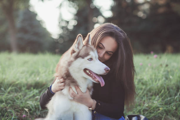 istock Young woman and her husky dog 1178285674