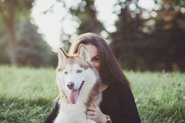istock woman hugging her dog 1178285734