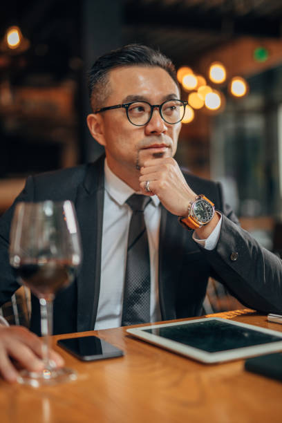 istock Businessman sitting alone in restaurant 1178287747