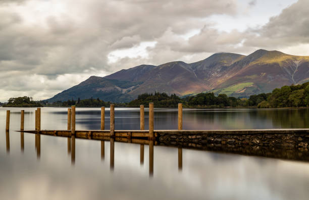 Skiddaw and Ashness jetty on Derwentwater Skiddaw and Ashness jetty on Derwentwater in the Lake District keswick photos stock pictures, royalty-free photos & images