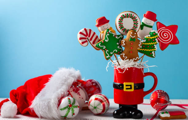 istock A set of Christmas gingerbread on a stick in a red gift cup with gift boxes 1178288716
