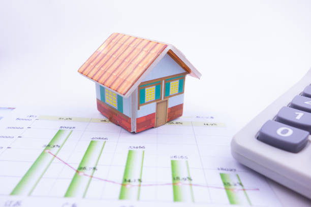 istock There is a small house on the business chart 1178288743