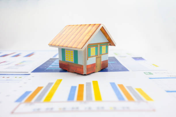 istock There is a small house on the business chart 1178288776